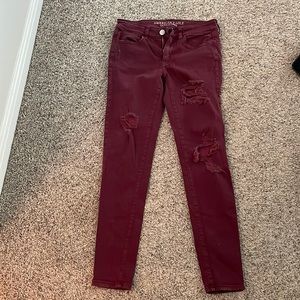 Maroon American eagle ripped skinny jeans